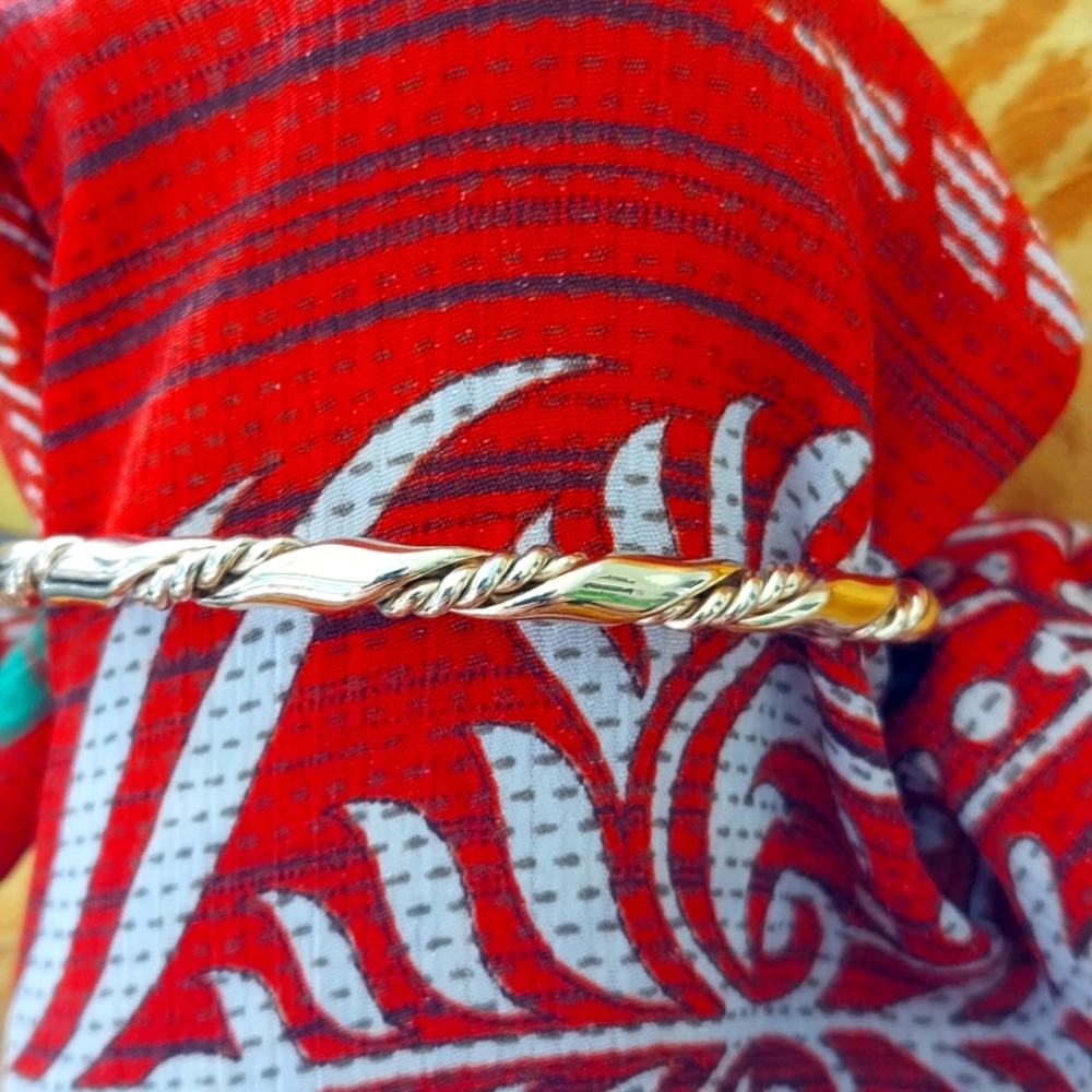 Twisted gold bangle bracelet